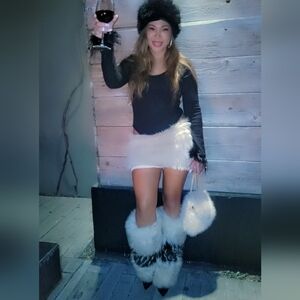 Black body suit and nude fur skirt